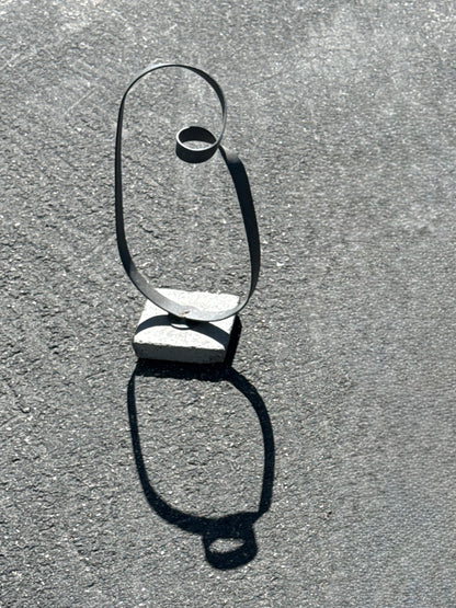 Minimalist Metal Loop Sculpture on Concrete Base