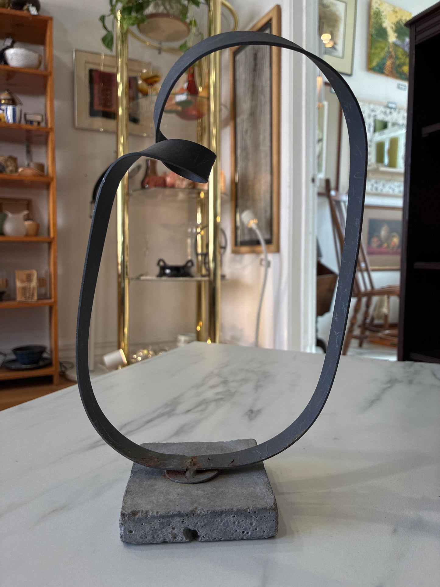 Minimalist Metal Loop Sculpture on Concrete Base